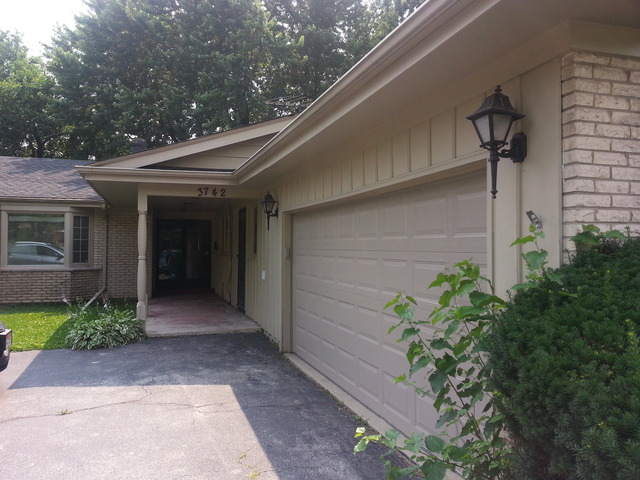 3742 Poplar Road Flossmoor, IL 60422 - Photo 2 of 20 a pathway of a house with potted plants
