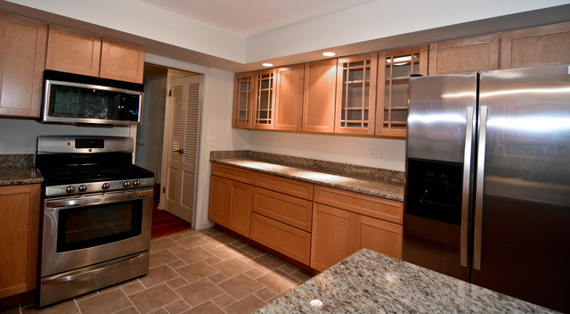 3742 Poplar Road Flossmoor, IL 60422 - Photo 11 of 20 a kitchen with stainless steel appliances granite countertop a refrigerator and a stove top oven