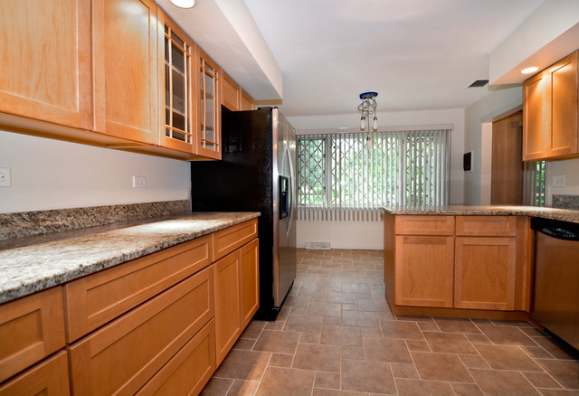 3742 Poplar Road Flossmoor, IL 60422 - Photo 12 of 20 a kitchen that has a sink and a stove