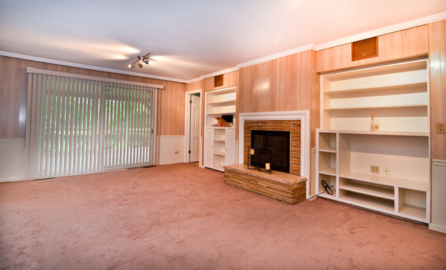3742 Poplar Road Flossmoor, IL 60422 - Photo 7 of 20 a view of an empty room with a fireplace and a window