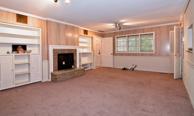 3742 Poplar Road Flossmoor, IL 60422 - Photo 9 of 20 a view of empty room with a fireplace and entryway