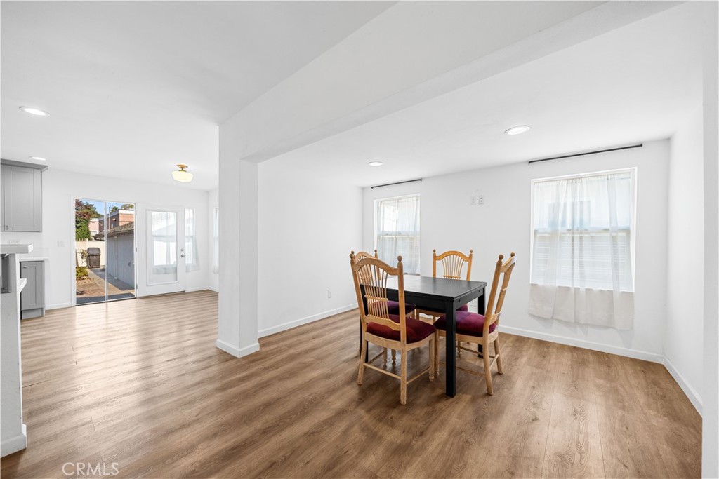 202 Mira Mar Avenue Long Beach, CA 90803 - Photo 11 of 49 a view of a dining room with furniture and wooden floor