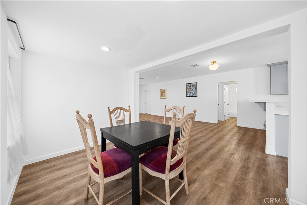 202 Mira Mar Avenue Long Beach, CA 90803 - Photo 12 of 49 a view of a dining room with furniture and wooden floor