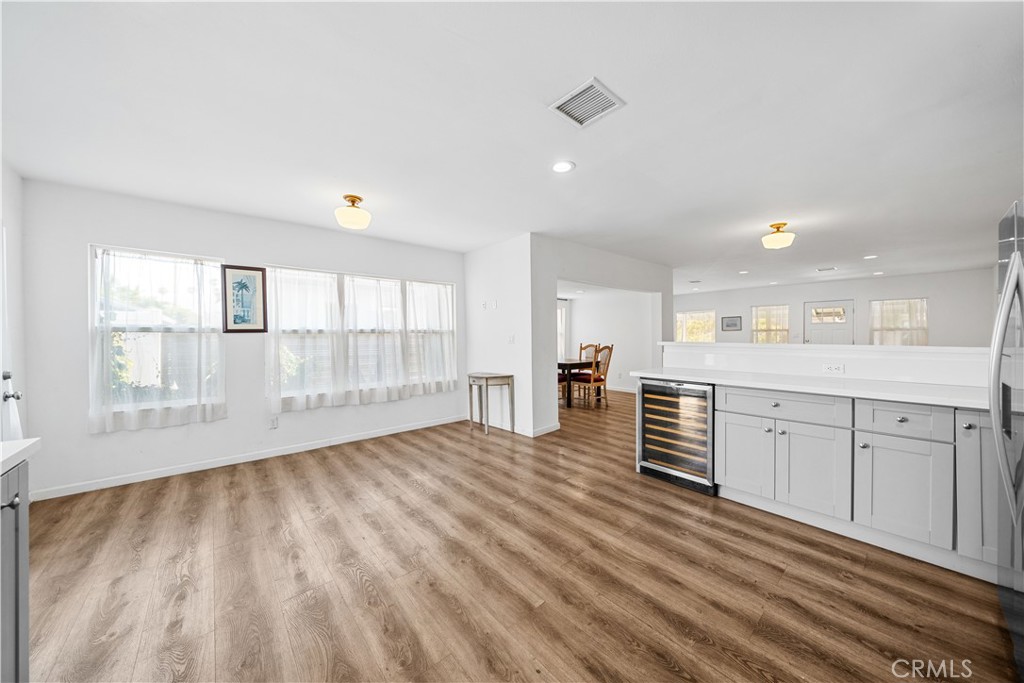202 Mira Mar Avenue Long Beach, CA 90803 - Photo 16 of 49 a view of a kitchen with wooden floor and windows