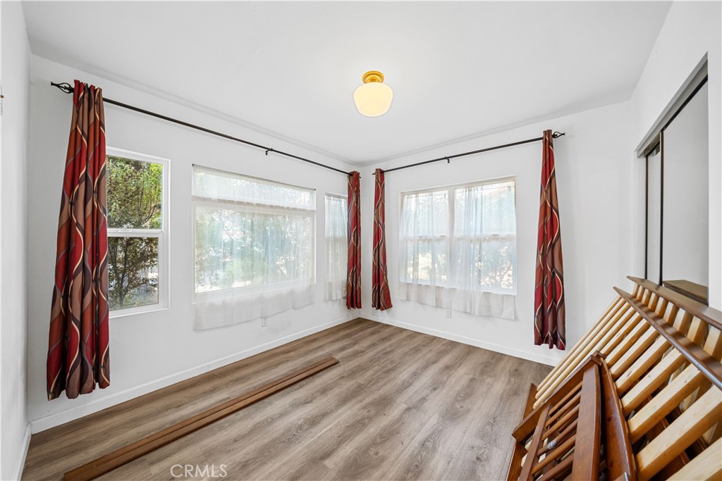 202 Mira Mar Avenue Long Beach, CA 90803 - Photo 17 of 49 a view of wooden floor and windows in a room