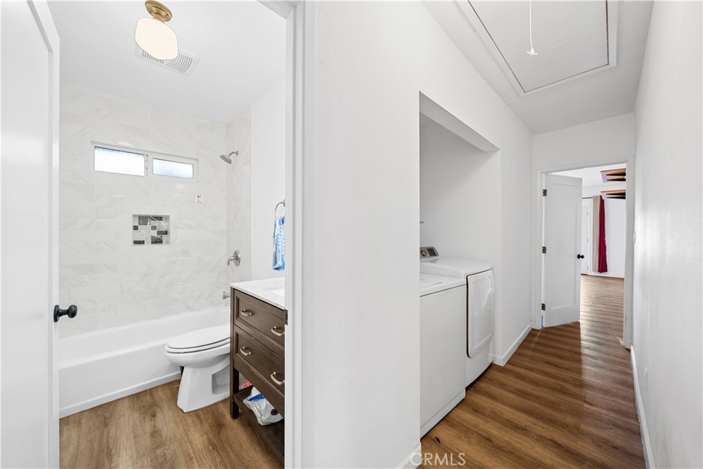 202 Mira Mar Avenue Long Beach, CA 90803 - Photo 19 of 49 a bathroom with a bathtub shower sink mirror and toilet