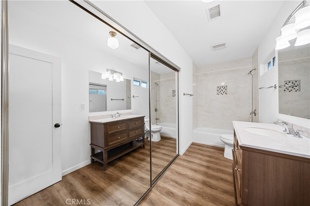 202 Mira Mar Avenue Long Beach, CA 90803 - Photo 24 of 49 a bathroom with a sink a mirror and a shower