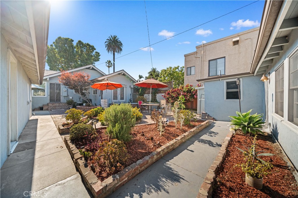 202 Mira Mar Avenue Long Beach, CA 90803 - Photo 30 of 49 a view of a chairs and table in the patio