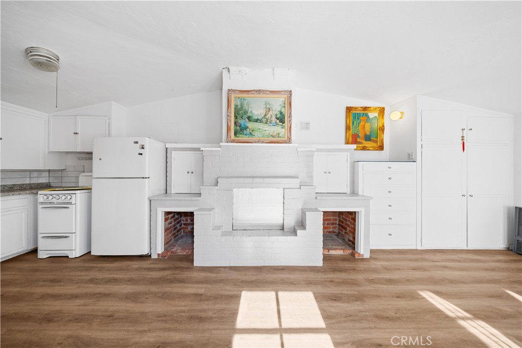 202 Mira Mar Avenue Long Beach, CA 90803 - Photo 37 of 49 a view of living room with furniture and a fireplace