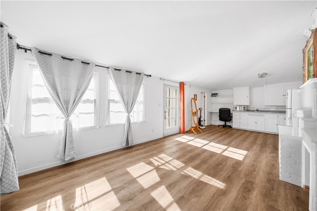 202 Mira Mar Avenue Long Beach, CA 90803 - Photo 39 of 49 a view of empty room with wooden floor and fan