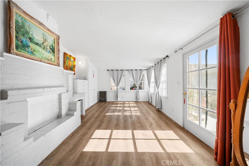 202 Mira Mar Avenue Long Beach, CA 90803 - Photo 40 of 49 a view of a bedroom with wooden floor and windows