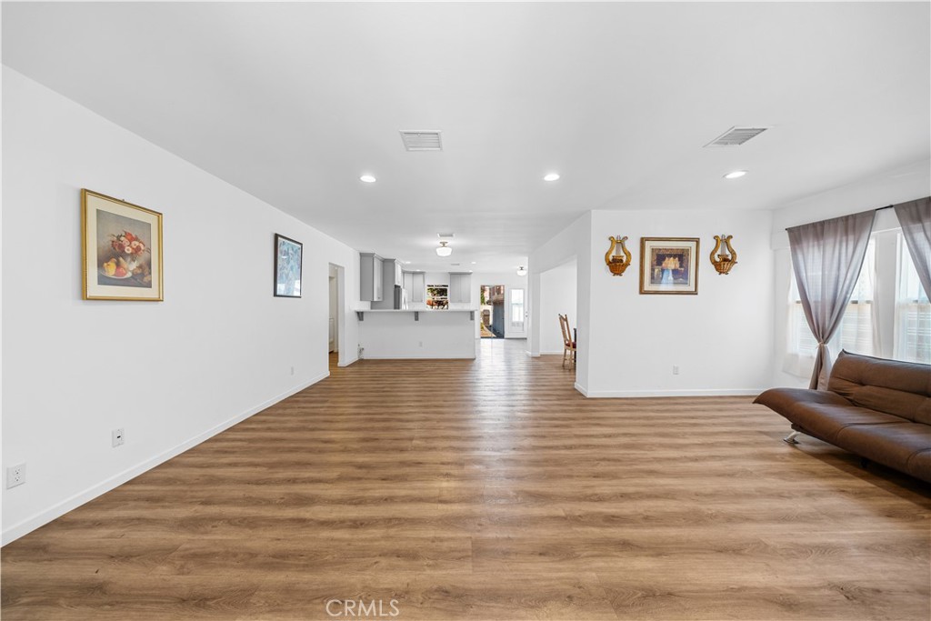 202 Mira Mar Avenue Long Beach, CA 90803 - Photo 4 of 49 a view of a livingroom with furniture wooden floor and window