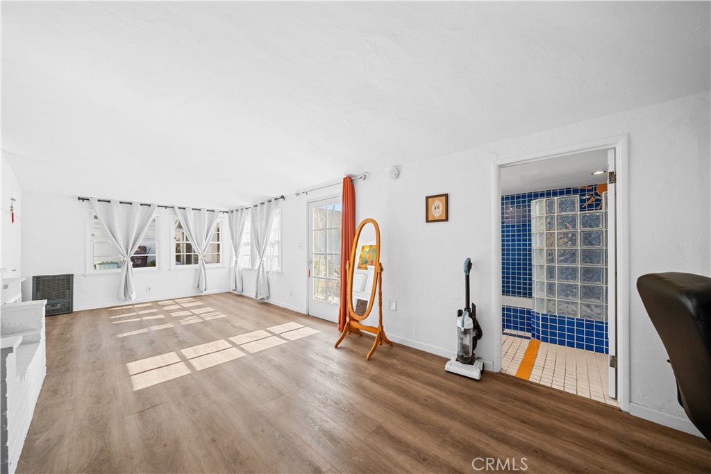 202 Mira Mar Avenue Long Beach, CA 90803 - Photo 41 of 49 a view of empty room with wooden floor and fan