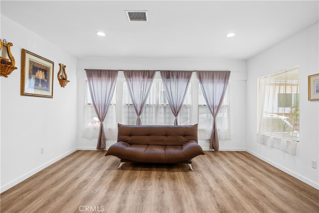 202 Mira Mar Avenue Long Beach, CA 90803 - Photo 6 of 49 a living room with furniture and a window