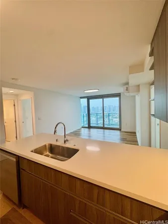 a kitchen with a sink cabinets and window