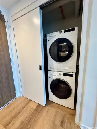 a view of a hallway with washer and dryer