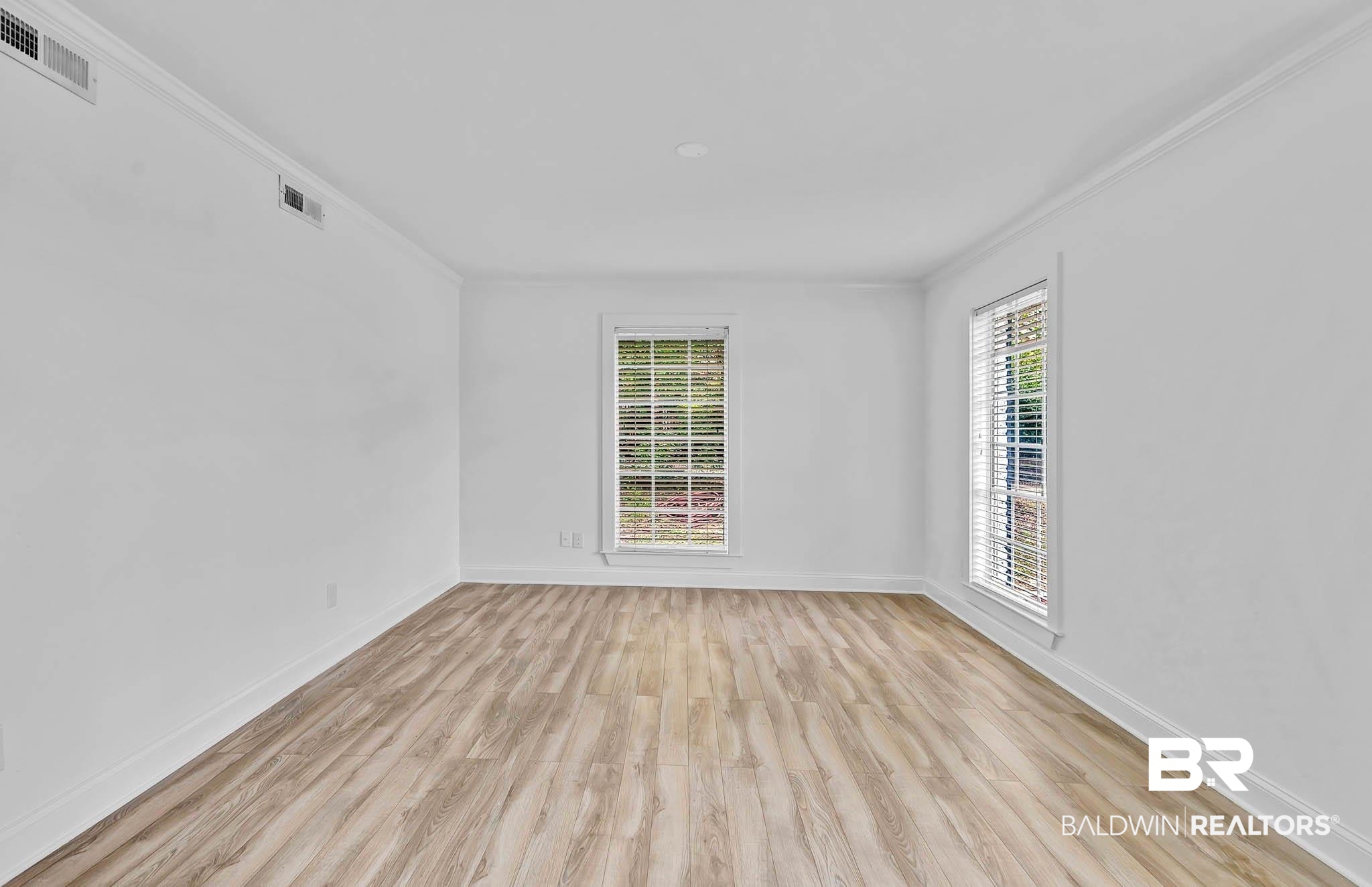 4705 Sherry Court Mobile, AL 36693 - Photo 12 of 100 Spare room featuring light wood-style floors and crown molding