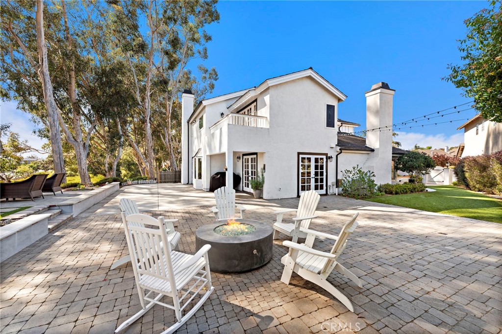 32946 Danaspruce Dana Point, CA 92629 - Photo 1 of 1 a view of a patio with couches table and chairs with wooden fence and plants