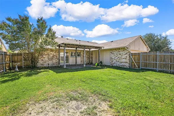 a view of a backyard with garden
