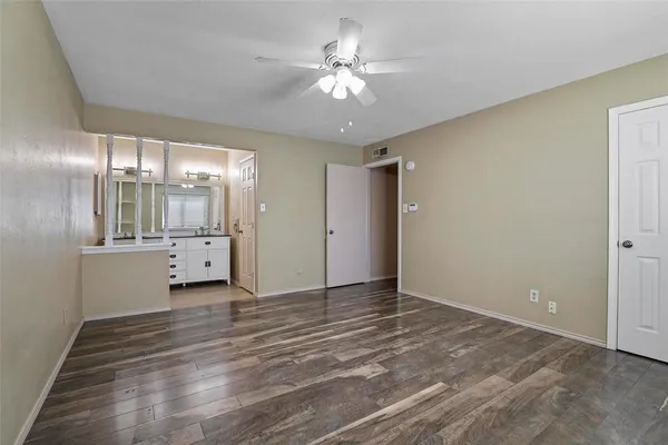a view of an empty room with a bathroom