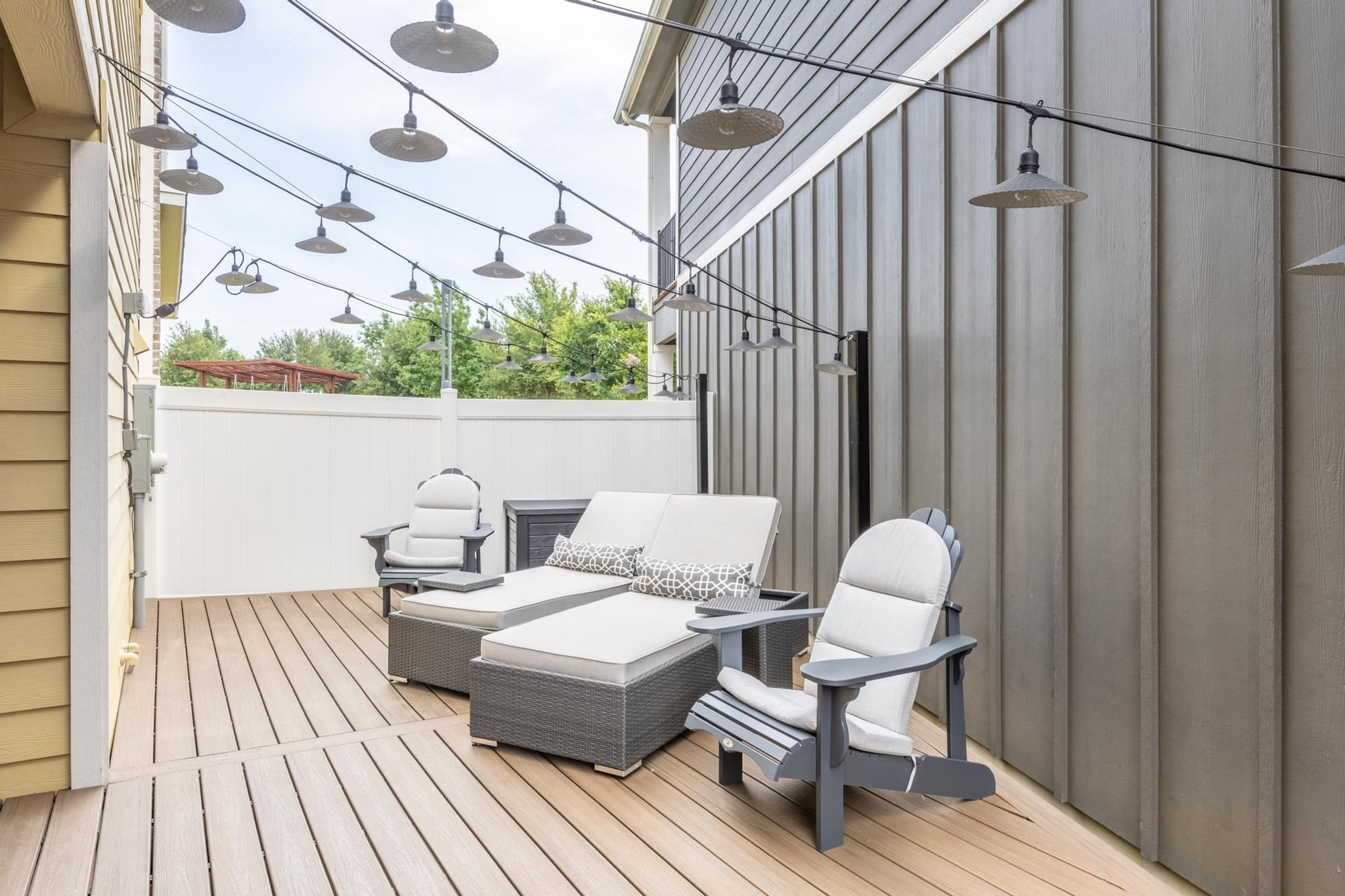 7801 Frida Bend Austin, TX 78744 - Photo 20 of 26 A private outdoor deck offers a serene escape, perfect for unwinding under string lights.