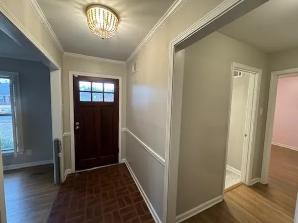 a view of entryway with wooden floor