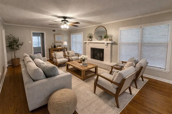 a view of a dining room with furniture and window