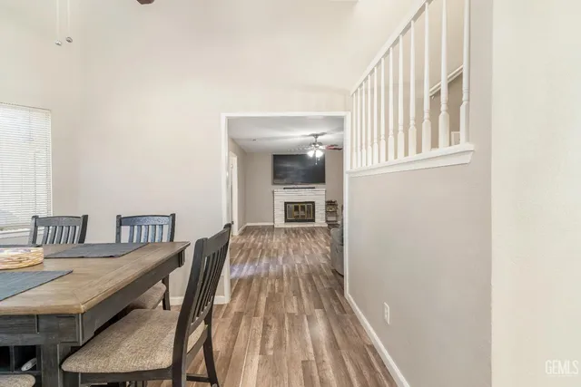 a view of a livingroom with furniture window and wooden floor