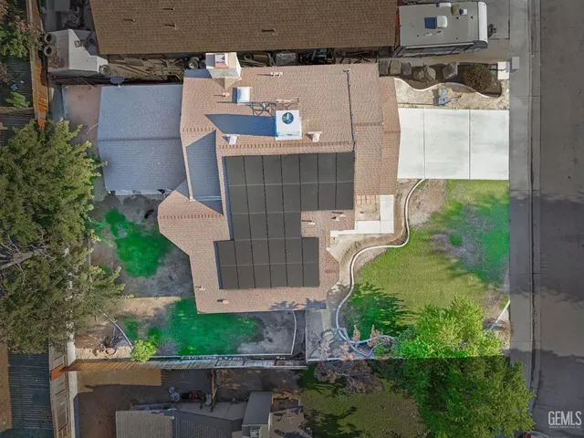 a aerial view of a house with a yard