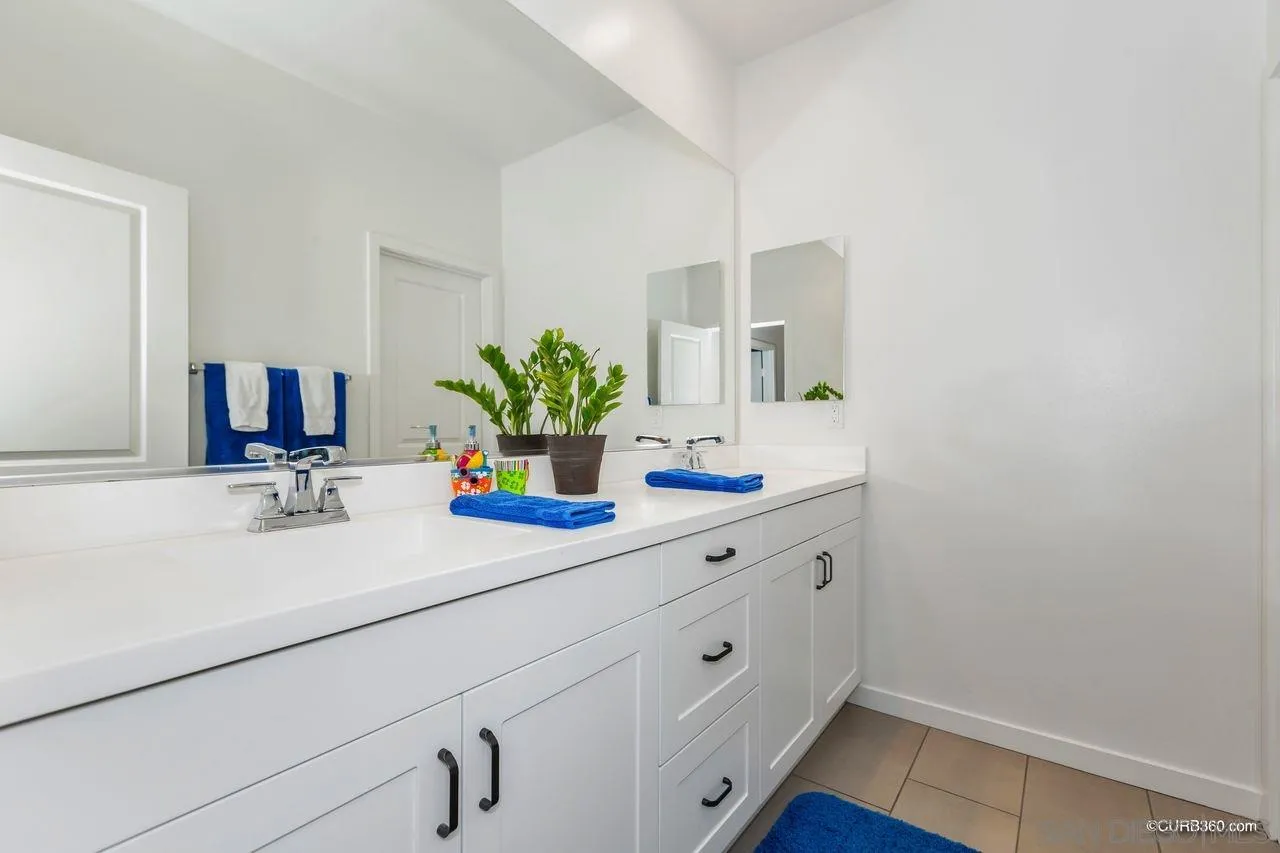 9014 Hightail Drive Santee, CA 92071 - Photo 20 of 45 a bathroom with a sink and a mirror