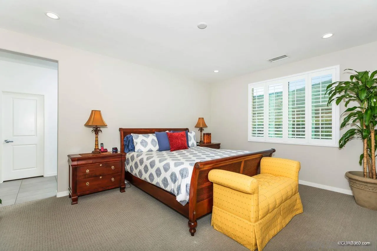 9014 Hightail Drive Santee, CA 92071 - Photo 21 of 45 a bedroom with a bed and a window