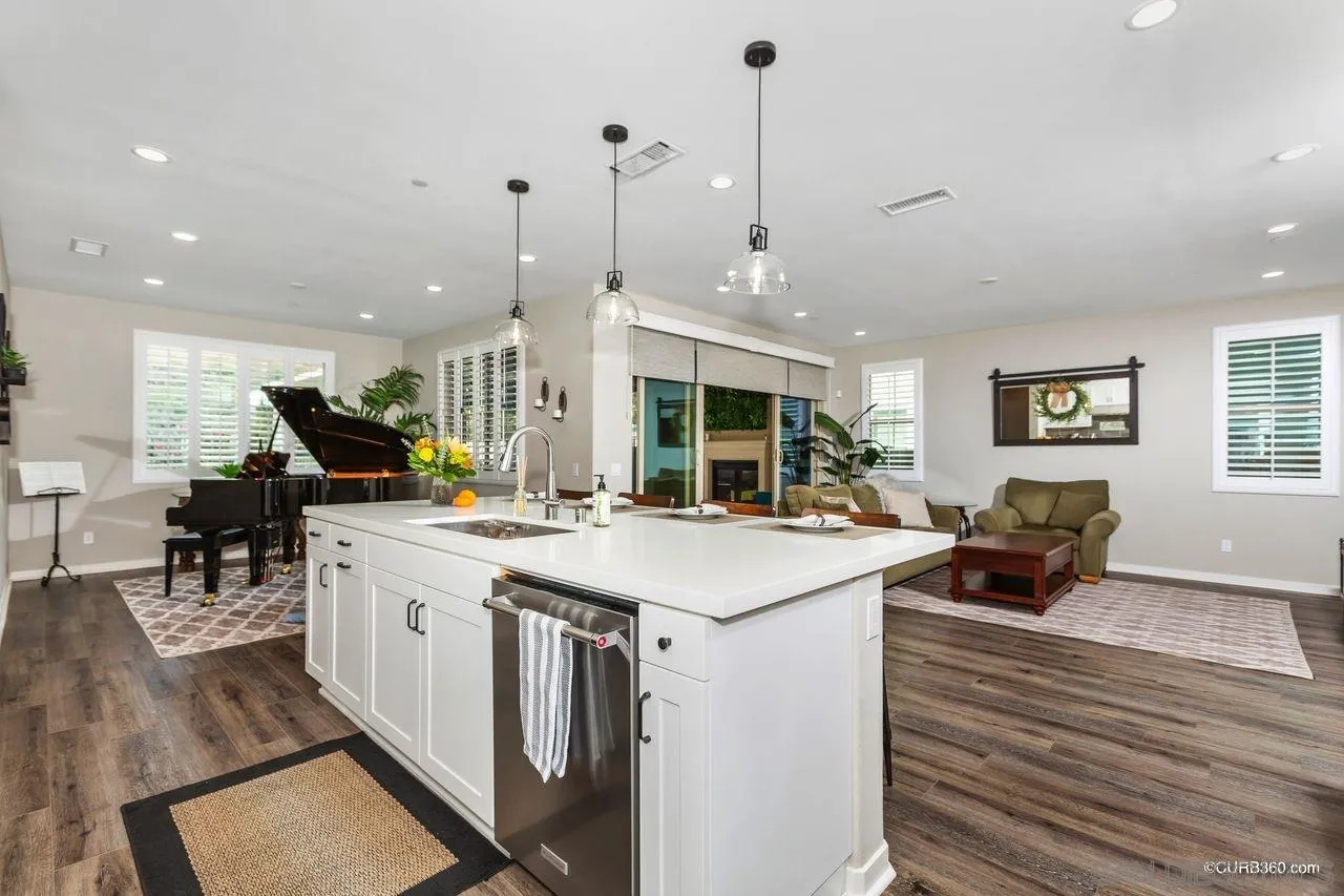 9014 Hightail Drive Santee, CA 92071 - Photo 8 of 45 a kitchen with stainless steel appliances granite countertop a sink and a stove