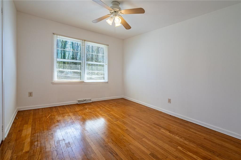 33 Summit Drive Lindale, GA 30147 - Photo 20 of 35 a view of an empty room with wooden floor and a window