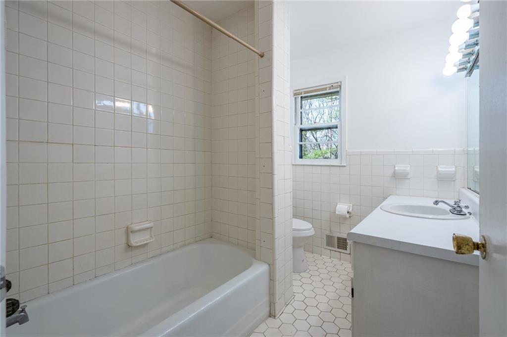 33 Summit Drive Lindale, GA 30147 - Photo 21 of 35 a bathroom with a sink a toilet and shower