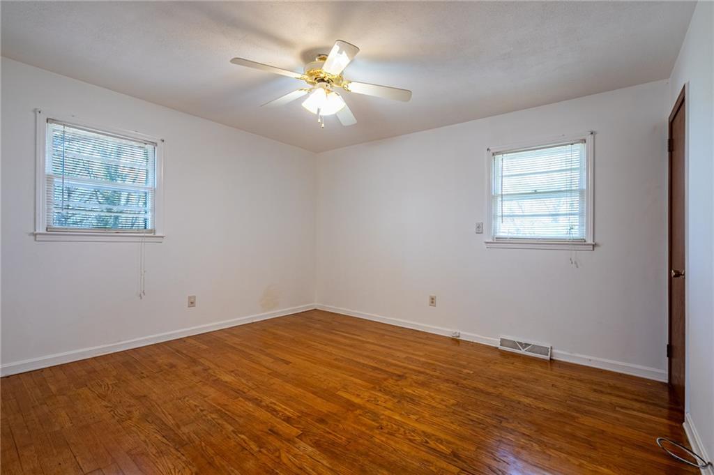 33 Summit Drive Lindale, GA 30147 - Photo 25 of 35 a view of an empty room with wooden floor and a window