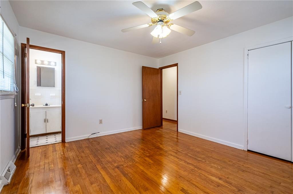 33 Summit Drive Lindale, GA 30147 - Photo 26 of 35 wooden floor in an empty room with a window