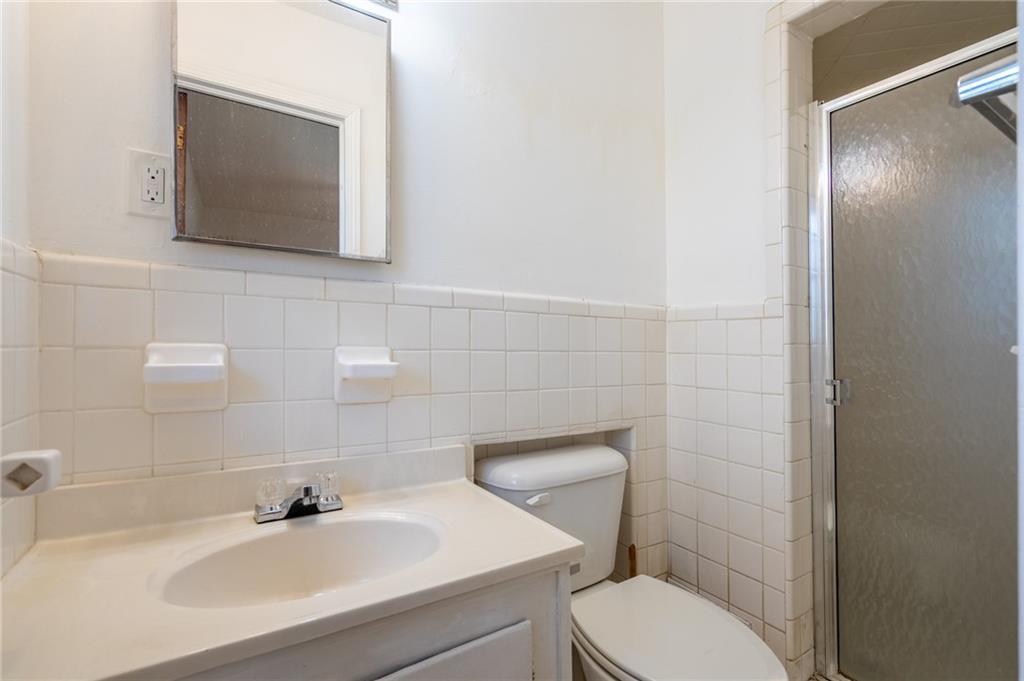 33 Summit Drive Lindale, GA 30147 - Photo 27 of 35 a bathroom with a toilet sink and mirror