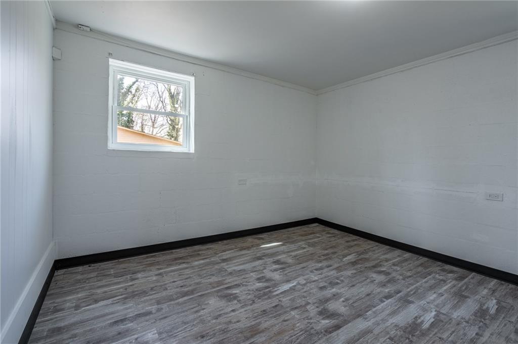 33 Summit Drive Lindale, GA 30147 - Photo 28 of 35 a view of an empty room with wooden floor and a window