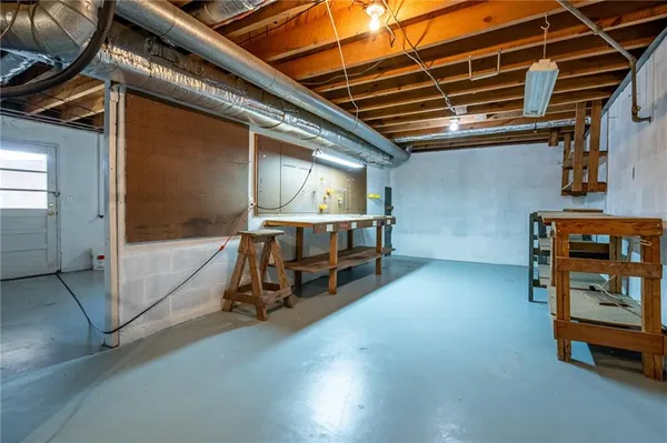 a view of a room with wooden shelves