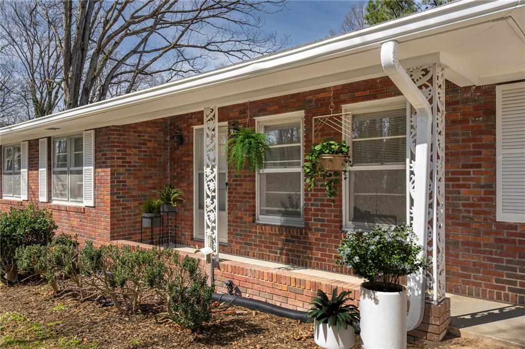33 Summit Drive Lindale, GA 30147 - Photo 4 of 35 a view of a house with a window and potted plants