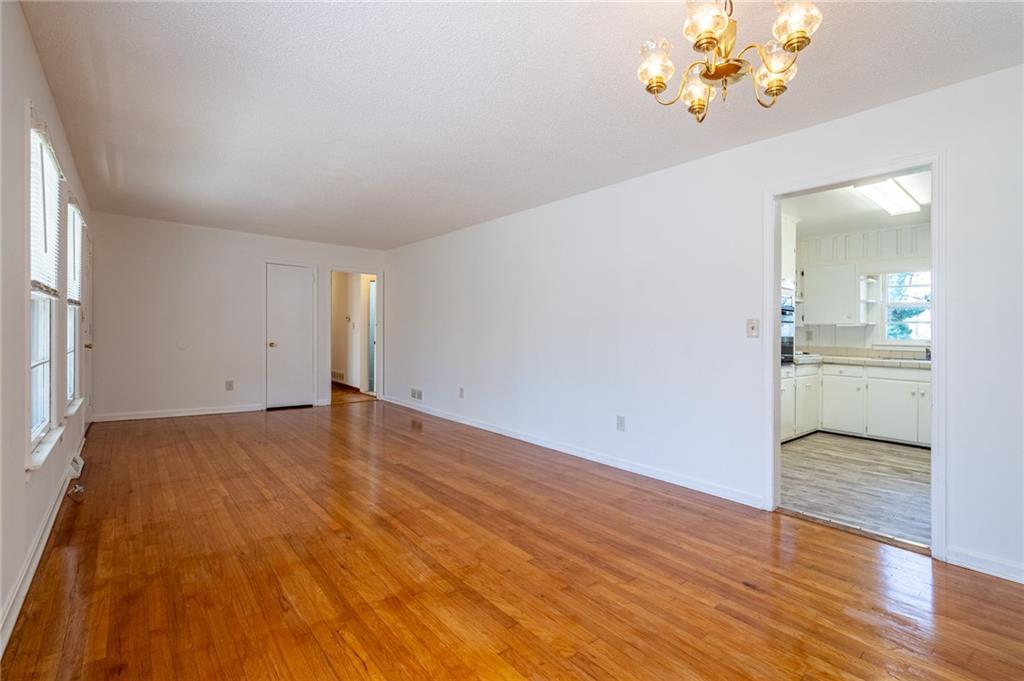 33 Summit Drive Lindale, GA 30147 - Photo 10 of 35 wooden floor in an empty room with a window