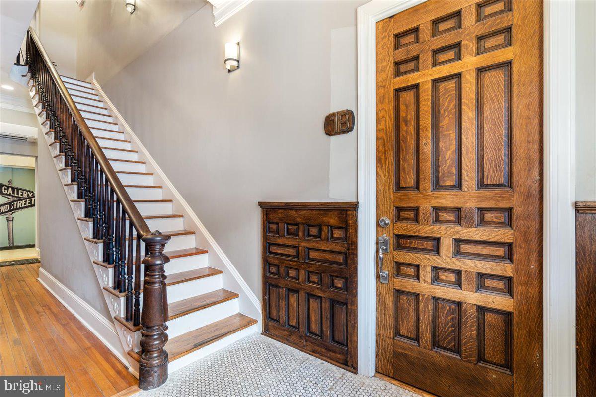 9 East 2nd Street, Unit 1B Frederick, MD 21701 - Photo 19 of 27 Foyer entry with original doors and trim