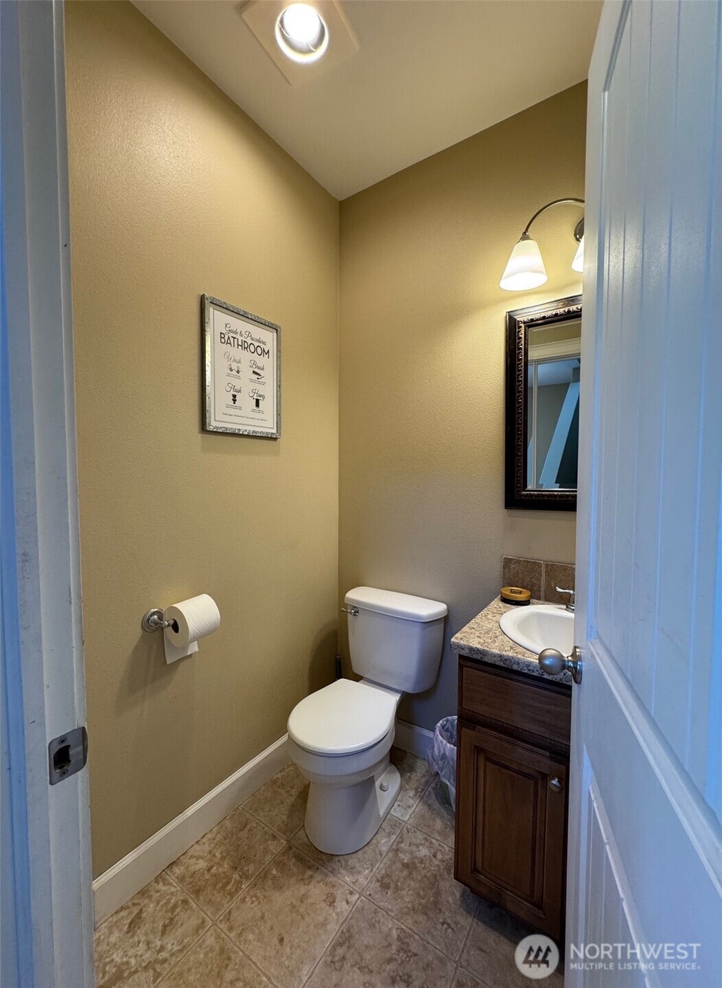 849 South McKinney Road Othello, WA 99344 - Photo 12 of 39 a bathroom with a toilet sink and mirror