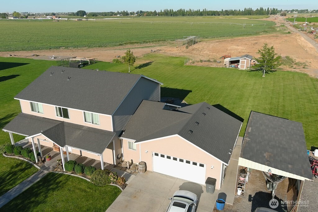 849 South McKinney Road Othello, WA 99344 - Photo 2 of 39 an aerial view of a house with a lake view
