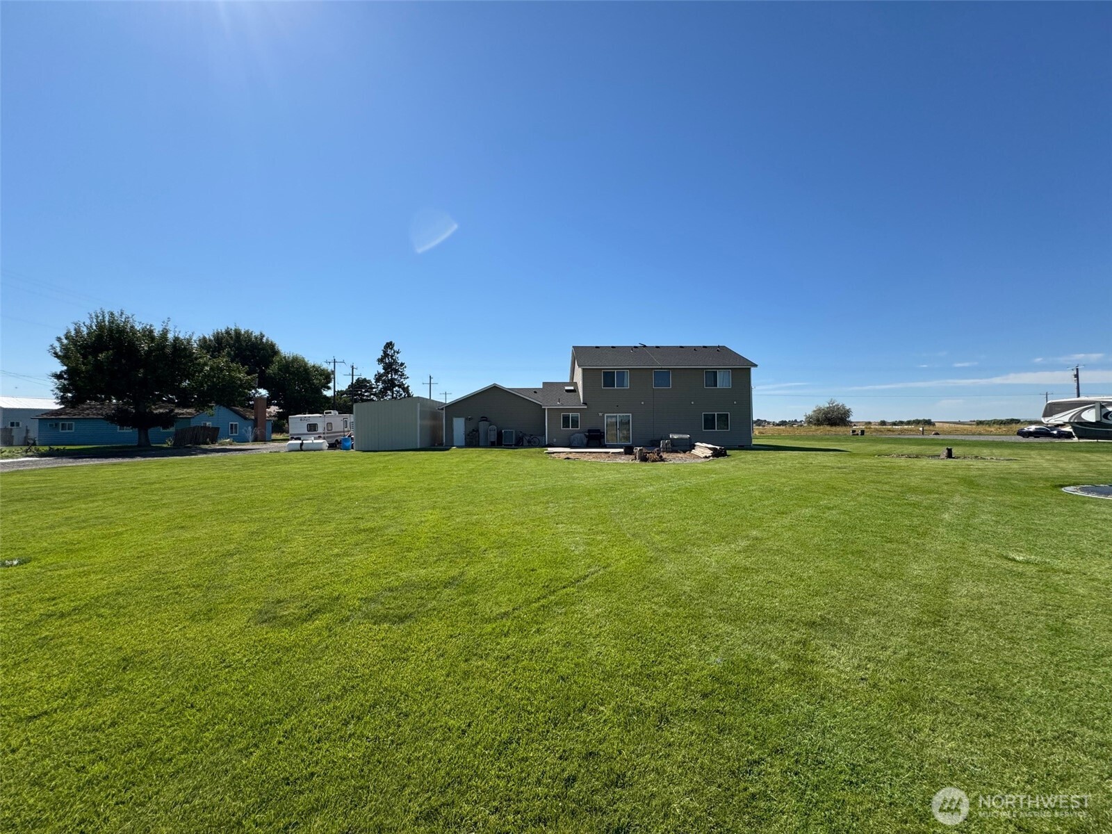 849 South McKinney Road Othello, WA 99344 - Photo 32 of 39 a view of a field with an trees