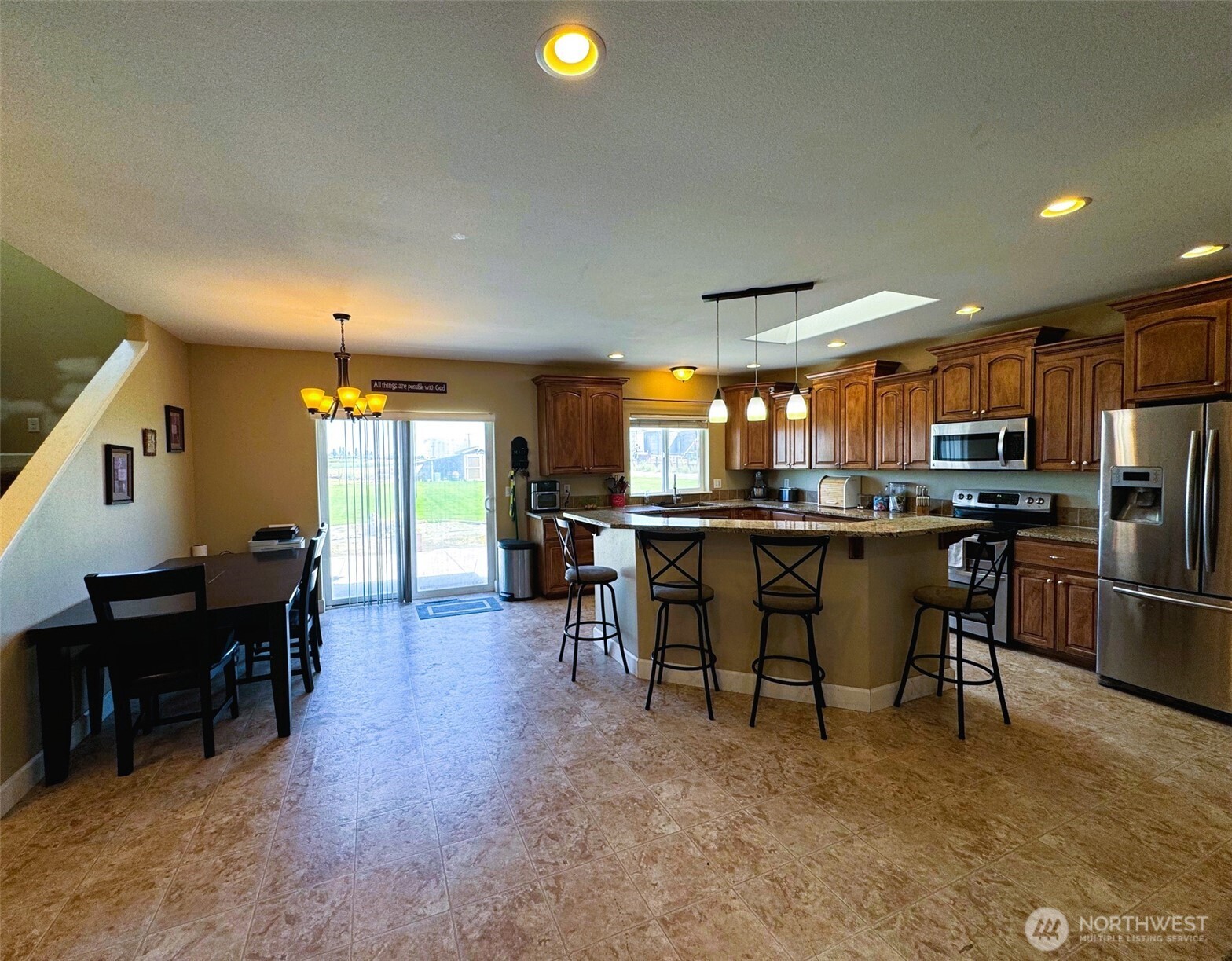 849 South McKinney Road Othello, WA 99344 - Photo 4 of 39 a living room with stainless steel appliances furniture a dining table and kitchen view
