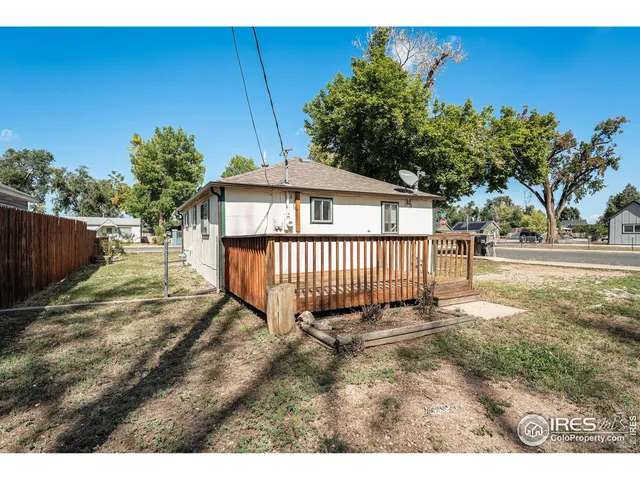 a view of a backyard with a small cabin