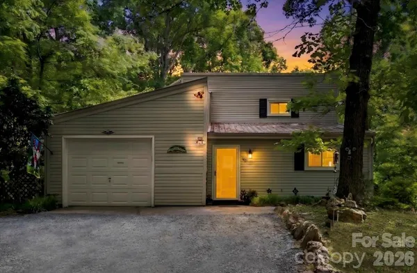 a front view of a house with garage