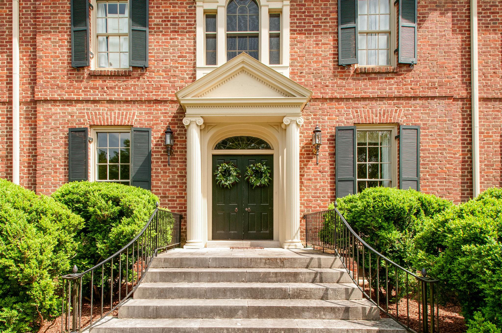 4737 Post Road Nashville, TN 37205 - Photo 2 of 30 a front view of a house with a garden