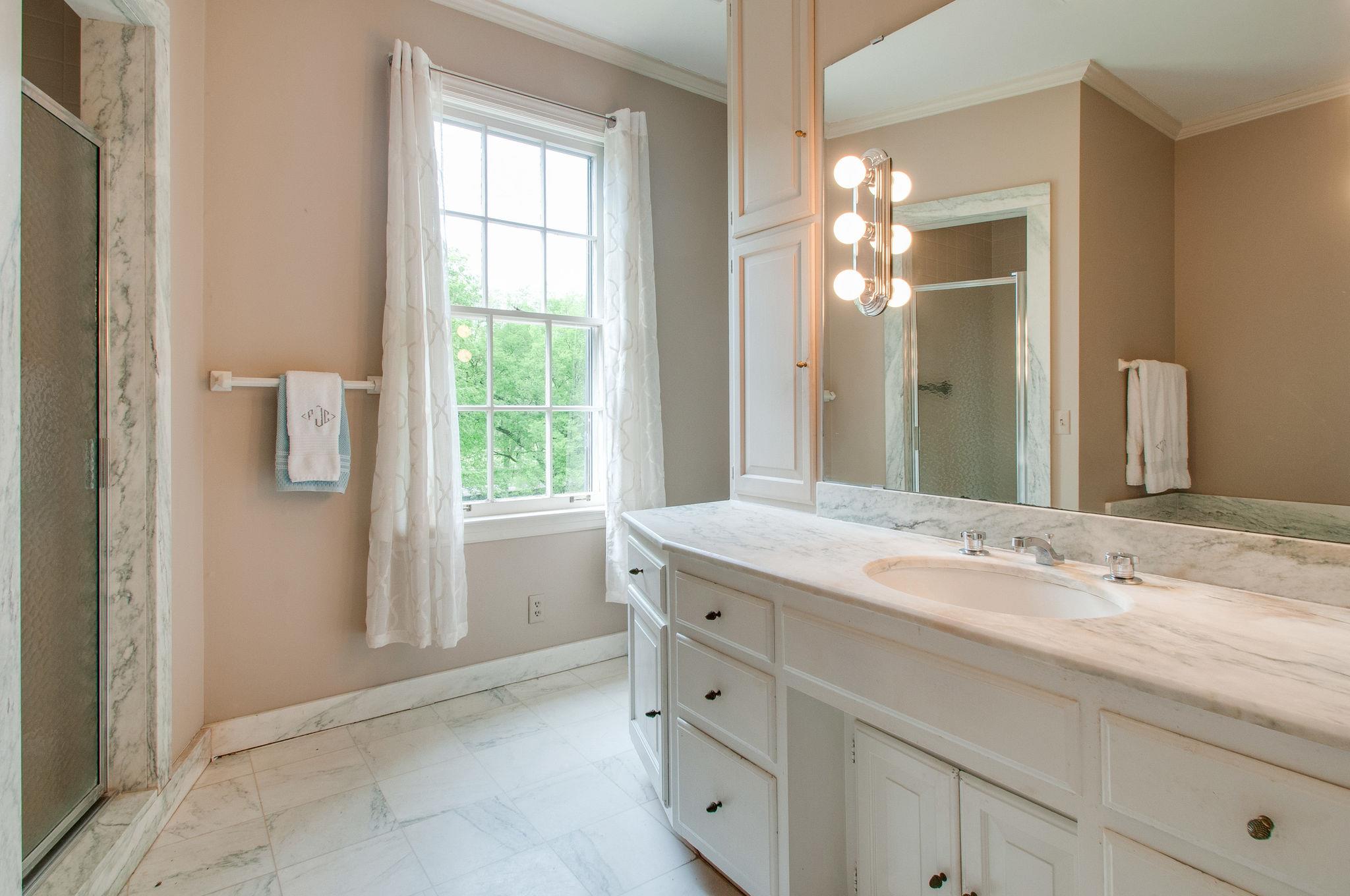 4737 Post Road Nashville, TN 37205 - Photo 24 of 30 a bathroom with a sink a vanity and a mirror
